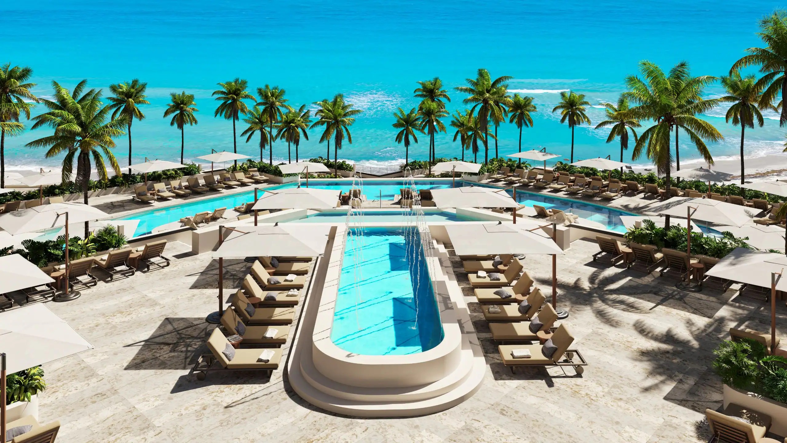 Piscinas do Hyatt Ziva Cancun com o mar Caribe ao fundo